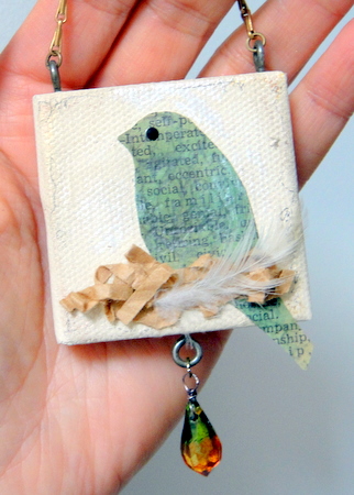 Mini canvas with scrapbook bird sitting on a nest.