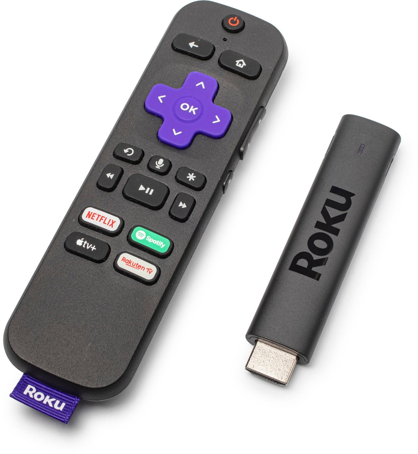 Slim black Roku streaming stick on the right and the remote for it on the left.