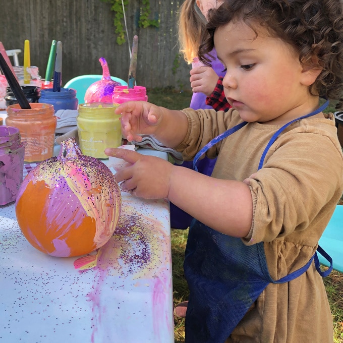 child painting pumpkin image