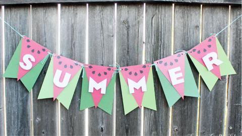 Paper banner that looks like watermelon with "summer" spelled out