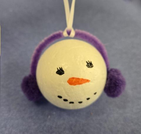 Snowman Ornament with purple earmuffs 