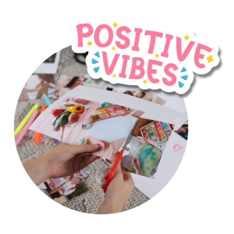 hands cutting out magazine images with text "Positive Vibes"