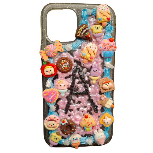 phone case covered in charms and textured paint