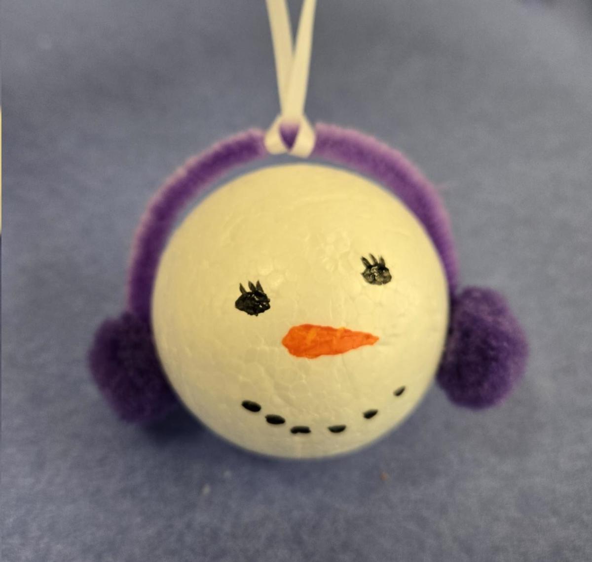 Snowman Ornament with purple earmuffs 